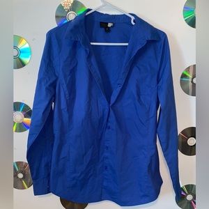 Blue button down collar shirt.